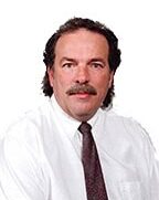 Portrait of Brian K. Pate, Senior Vice President and Chief Credit Officer of Andrew Johnson Bank, presenting a confident and professional image.