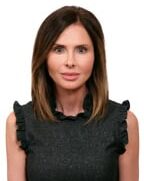 Portrait of Paige M. Hull, President and CEO of Andrew Johnson Bank, showcasing a professional and confident appearance.