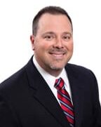 Portrait of Ted E. Ganger Jr., Senior Vice President and City Executive for Washington County, demonstrating strong leadership and expertise.